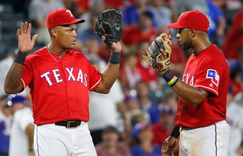 Texas Rangers third baseman Adrian Beltre (29) and shortstop Elvis Andrus (1) are pictured...