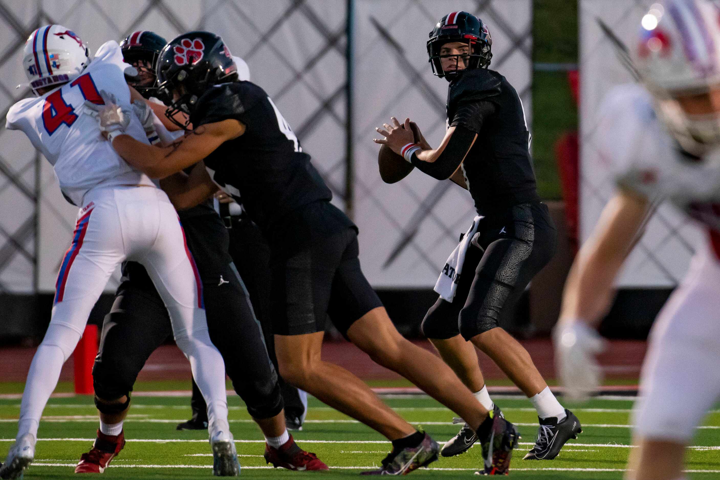 Colleyville senior Weston Smith (6) looks at a receiver down the field before throwing the...