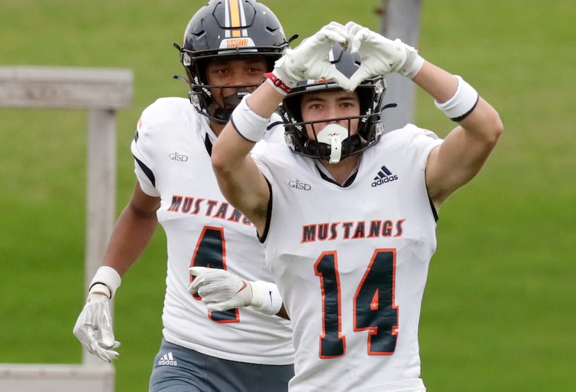 Sachse High School wide receiver Robbie Rothrock (14) sends a message to the fans after...