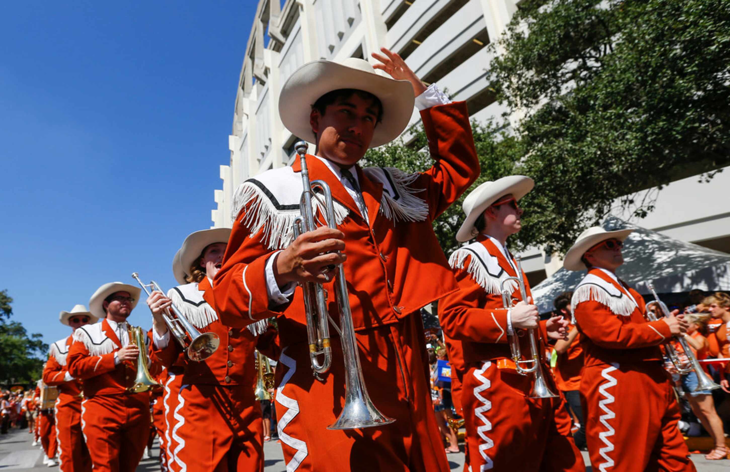 The Longhorn Band marches during the Bevo Parade prior to a college football game between...