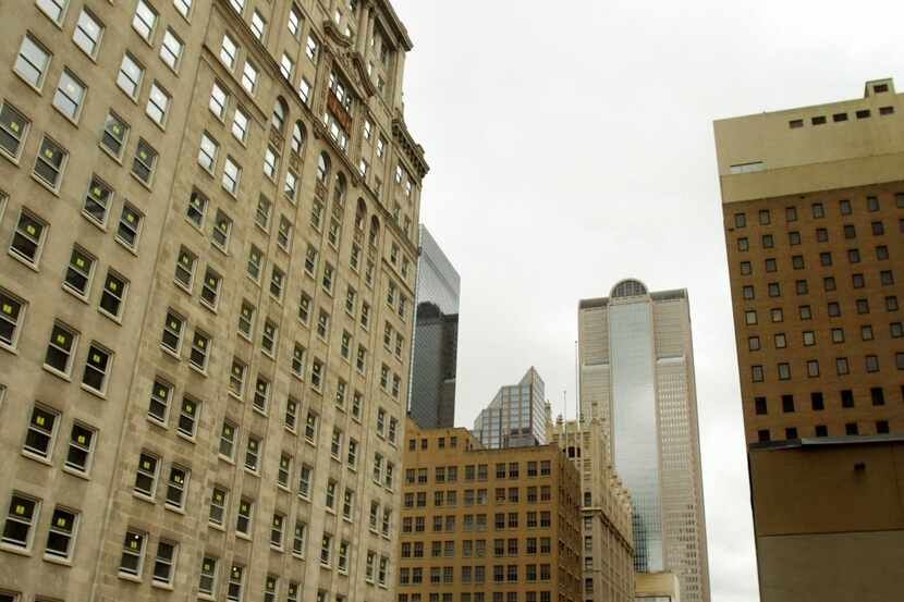 The Davis Building (left) on Main Street in downtown Dallas, is one of the state's largest...