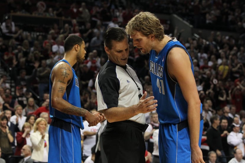 Dallas Mavericks forward Dirk Nowitzki (41) exchanges words with an official in the first...