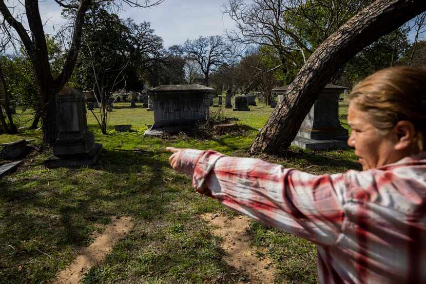 Cemetery administrator and volunteer Monica Newbury pointed out on Tuesday some of the tall...