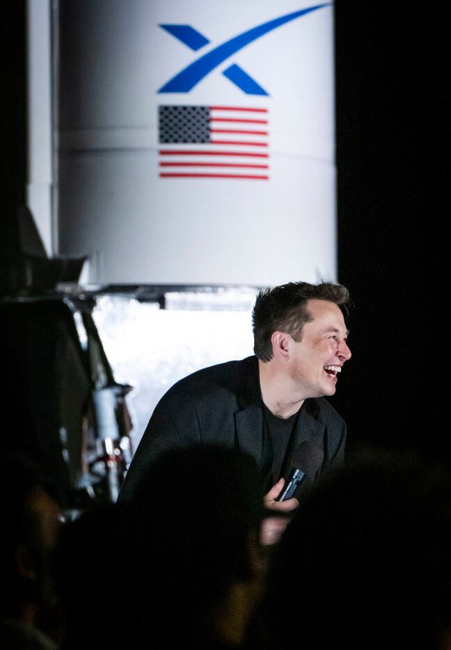 SpaceX founder Elon Musk makes a presentation in front of Falcon 1 rocket that was next to a...