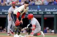 Texas Rangers pitcher Andrew Heaney (44) watches as Los Angeles Angels’ Luis Rengifo scores...