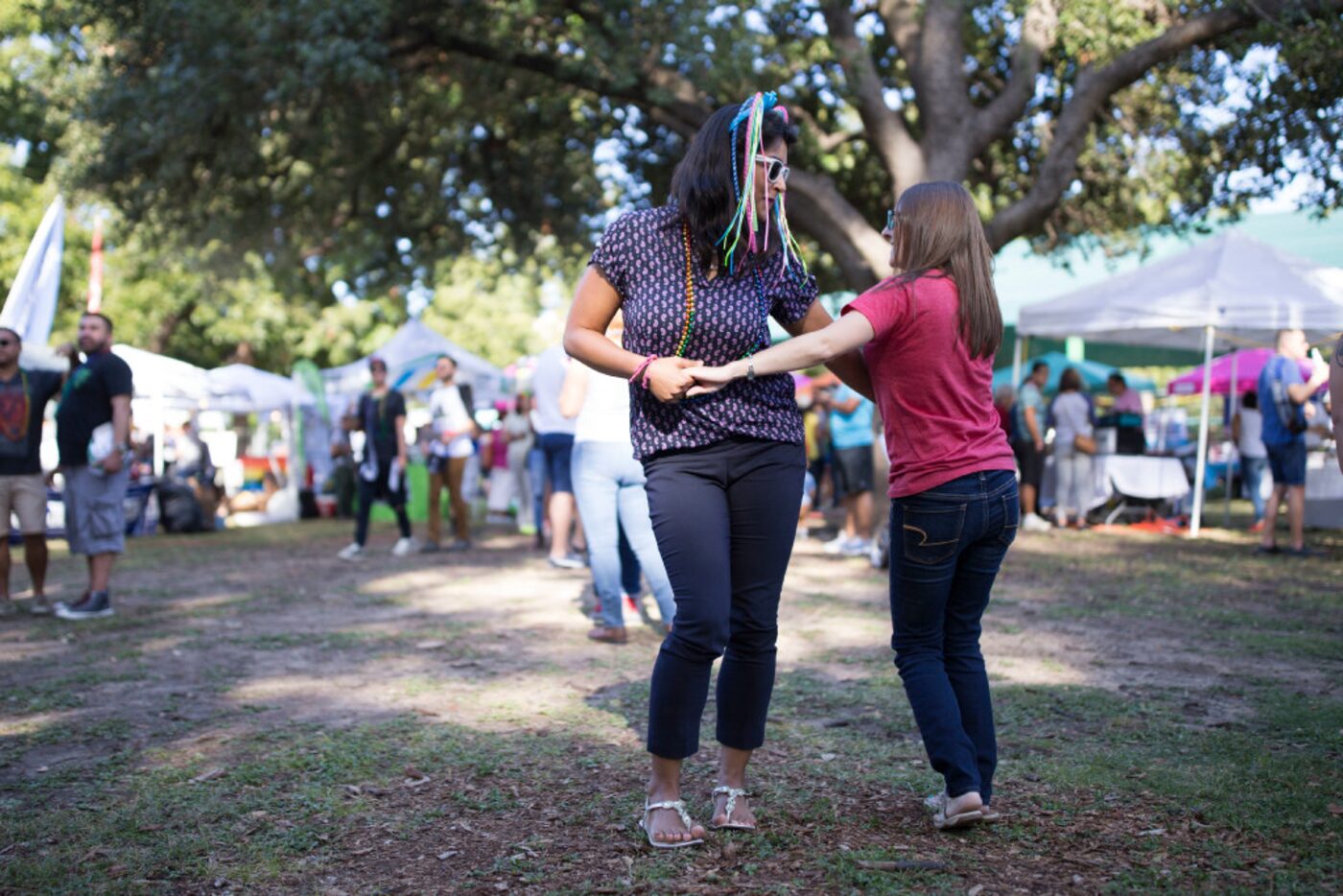 Natalia Darancou (left) and Erin Garey, both of Dallas, danced to the music during the Texas...