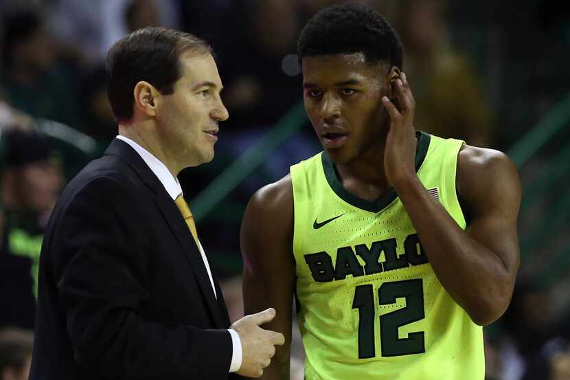 Baylor head coach Scott Drew talks with Baylor guard Jared Butler (12) in the first half of...