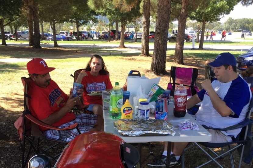  The Enriquez family of Waxahachie were among the few Texas Rangers fans cooking out before...