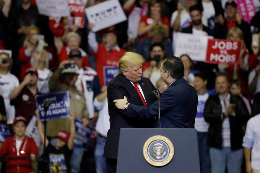 President Donald Trump, left, embraces Sen. Ted Cruz, R-Texas, during a campaign rally,...