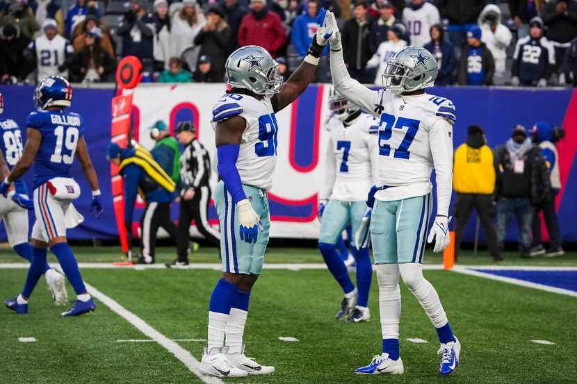 Dallas Cowboys safety Jayron Kearse (27) celebrates with defensive end Demarcus Lawrence...