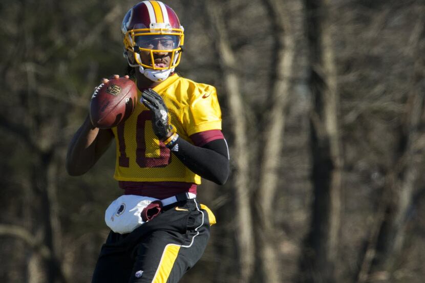 FILE - In this Jan. 6, 2016 file photo, Washington Redskins quarterback Robert Griffin III...