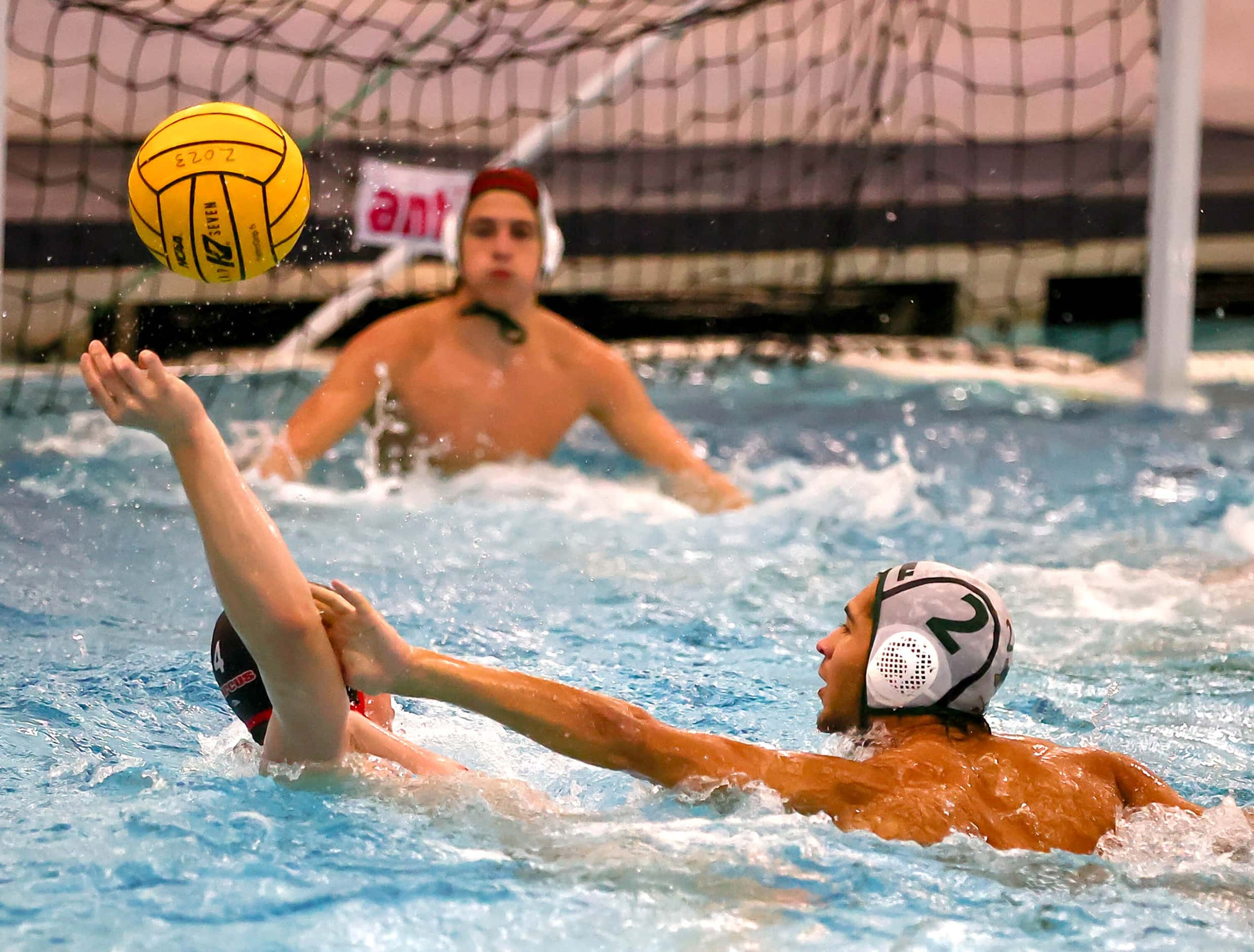 Southlake Carroll's Louie Christensen (2) tries to block shot attempt against Flower Mound...