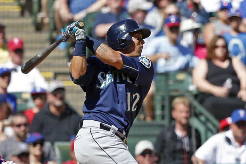 Seattle Mariners center fielder Leonys Martin (12) watches his RBI double against Texas...