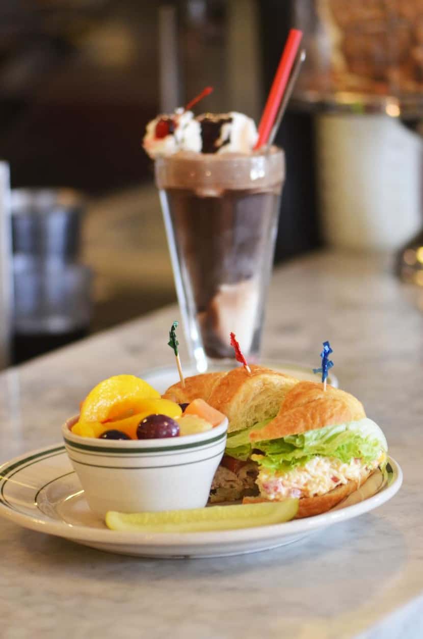 
 Star Drug’s cool sandwich trio pairs with a chocolate soda for a refreshing break at the...