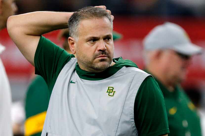 Baylor Bears head coach Matt Rhule watches his team during warm up before facing the...