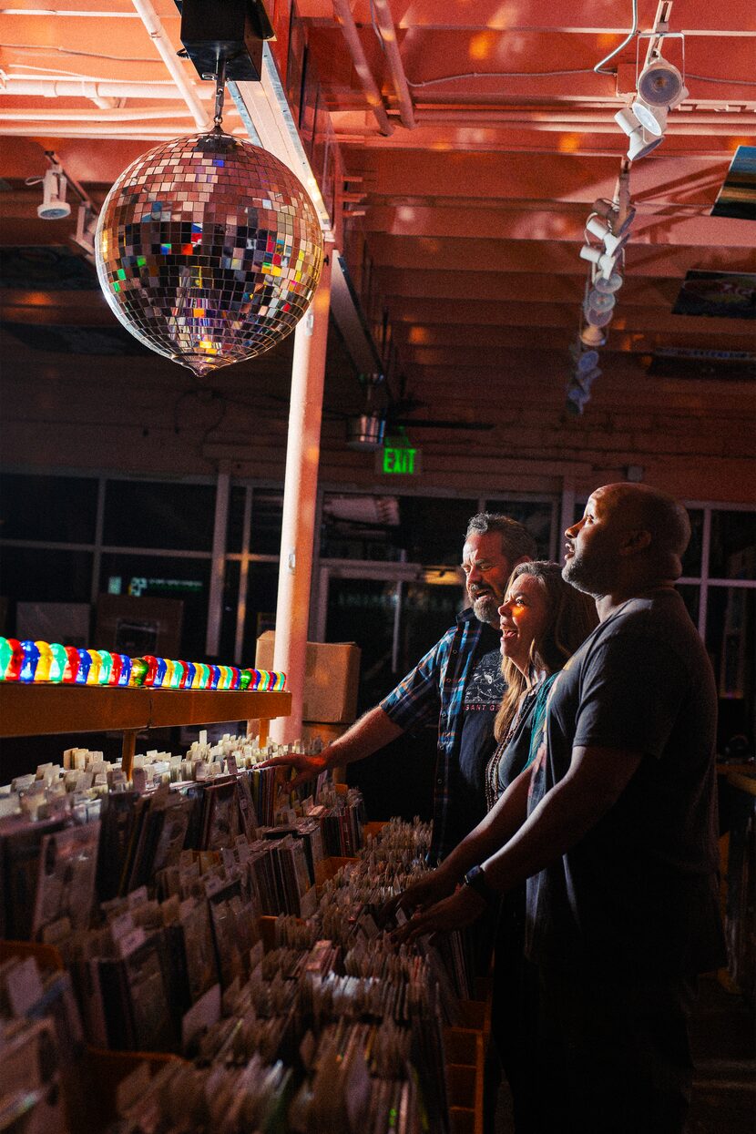 Max Hartman (from left), Karen Parrish and Jamal Sterling, shown under the light of a mirror...