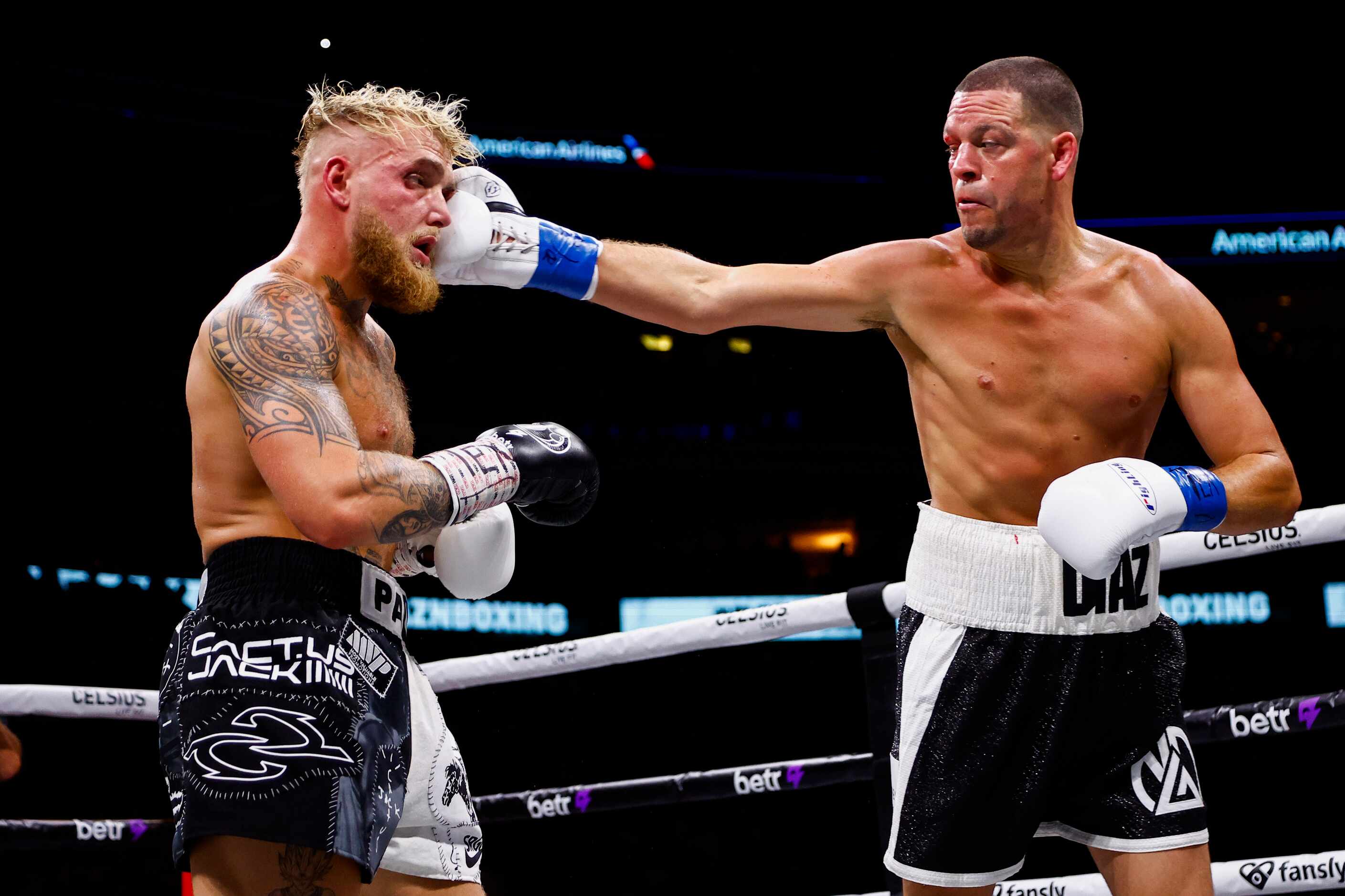 Nate Diaz, right, lands a punch on Jake Paul during a boxing match in Dallas, Saturday,...