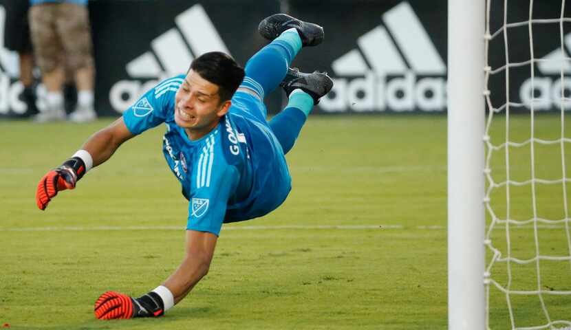 FC Dallas goalkeeper Jesse Gonzalez (1) dives to try a block a shot during the FC Dallas vs....