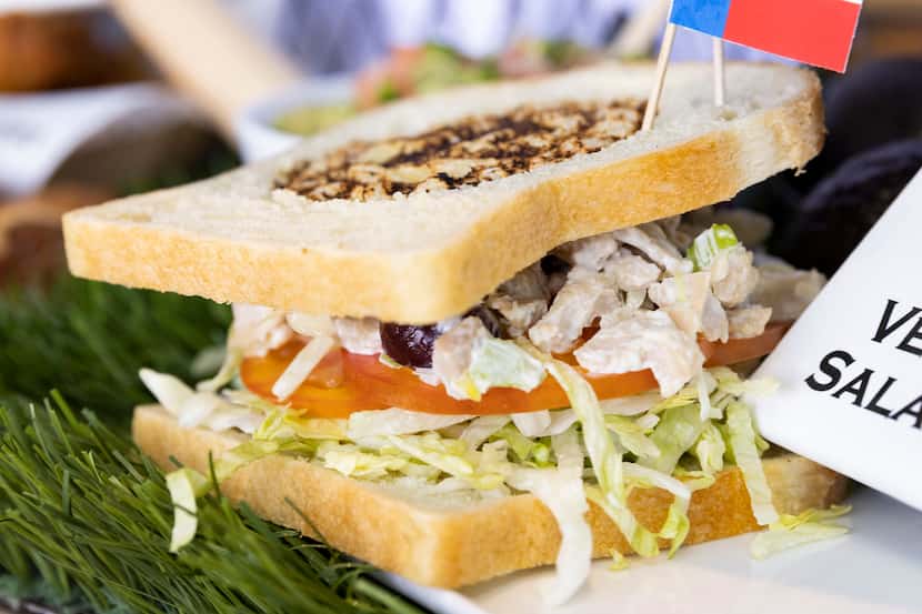 The vegan chicken salad sandwich sold during 2022 Rangers games has grapes, sliced tomato...