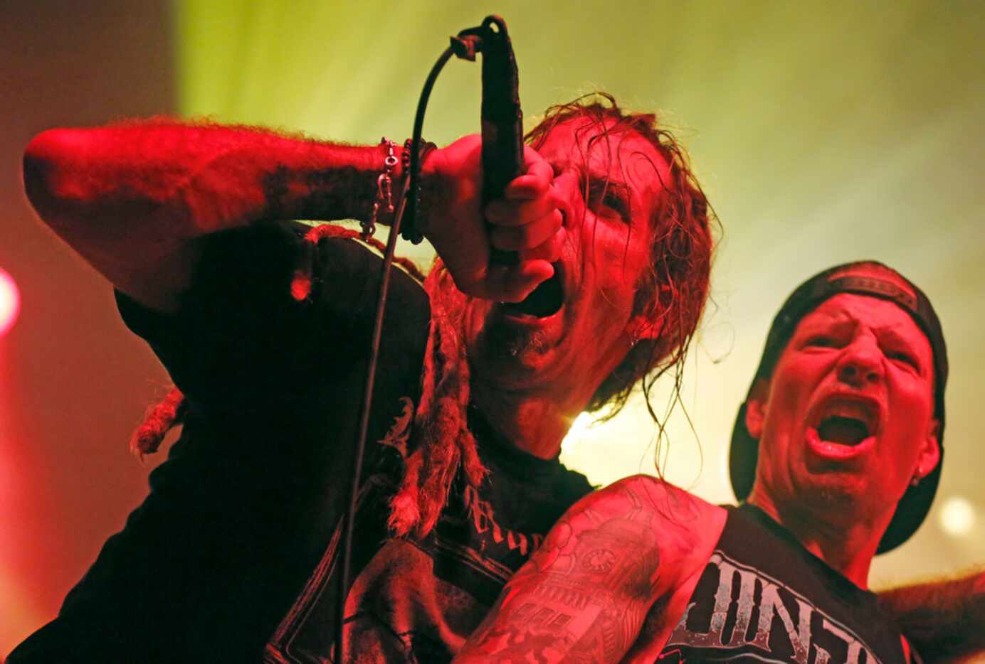 Lamb of God vocalist Randy Blythe and guitarist Willie Adler perform during their opening...