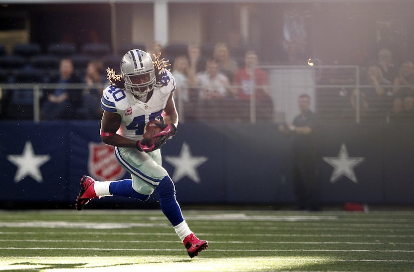 Dallas Cowboys strong safety Danny McCray (40) returns an interception against the New York...