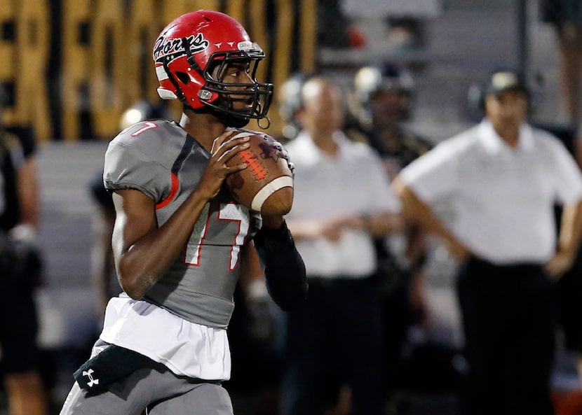 TXHSFB Cedar Hill junior quarterback Shayne Lawrence (17) looks to pass during the first...