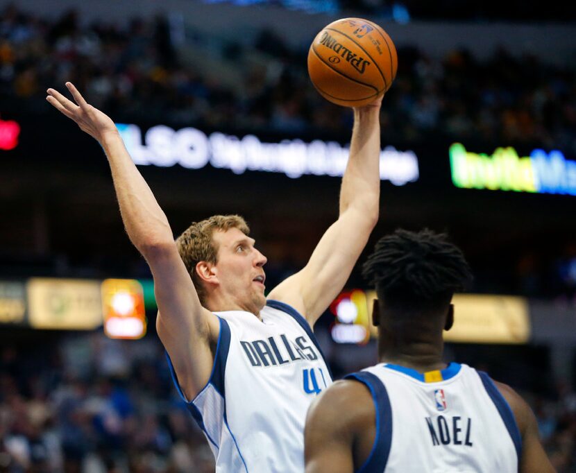 Dallas Mavericks forward Dirk Nowitzki (41) comes down with a defensive rebound against the...