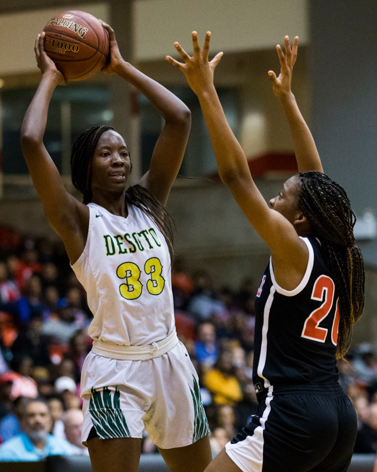 DeSoto's Amina Muhammad (33) looks for a pass around Duncanville's Anaya Bernard (20) during...