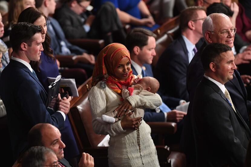 Newly elected congresswoman Ilhan Omar (D-MN)holds a baby during the 116th Congress and...