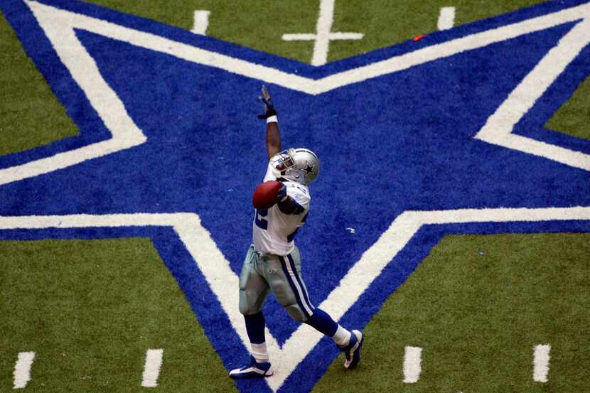Dallas Cowboys running back Emmitt Smith celebrates setting the all-time career rushing...