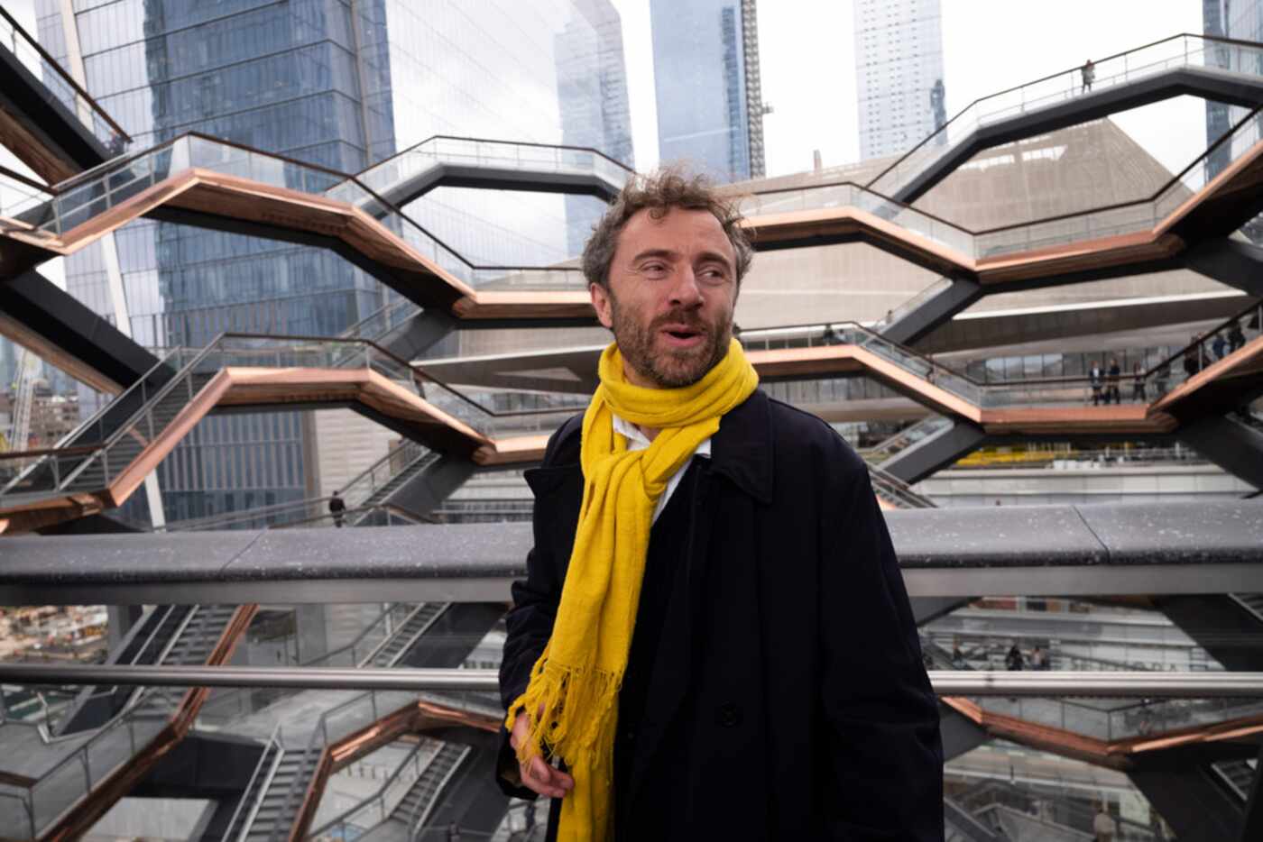 British designer Thomas Heatherwick climbs the steps of  the Vessel on its opening day at...