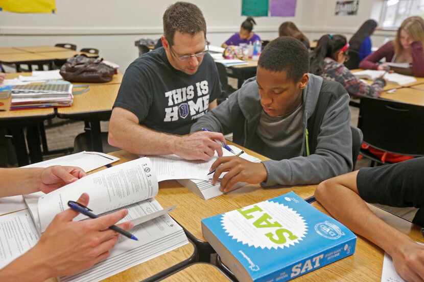 
Teacher Wes Dennis helped Andrew Mburia during an SAT prep class at Independence High...