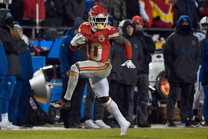 Kansas City Chiefs wide receiver Tyreek Hill (10) runs with the ball during the second half...