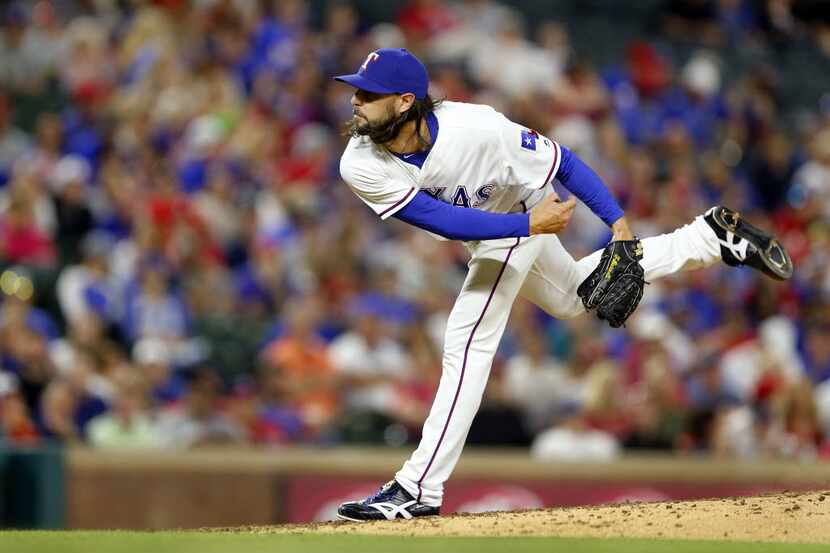 Texas Rangers relief pitcher Tony Barnette (43) throws against the Seattle Mariners in the...