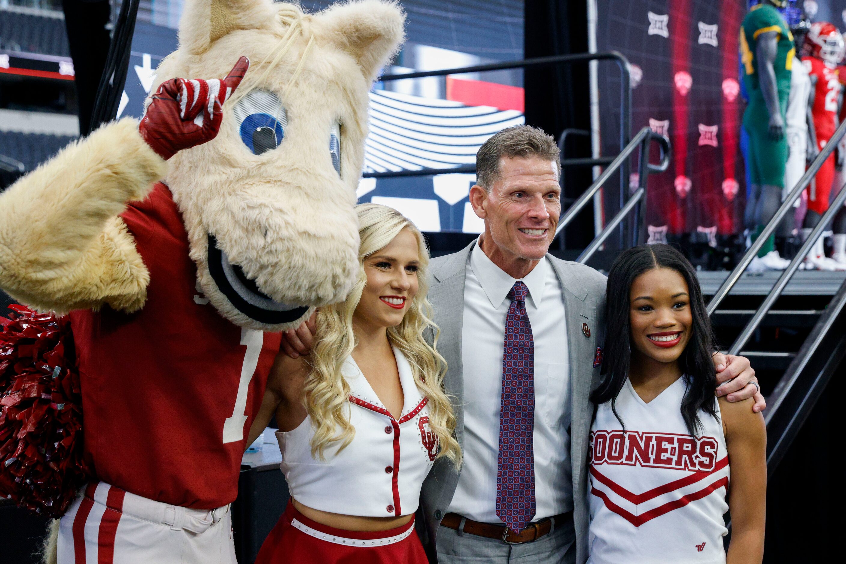 Oklahoma head coach Brent Venables poses for a photo with cheerleaders and Oklahoma mascot...