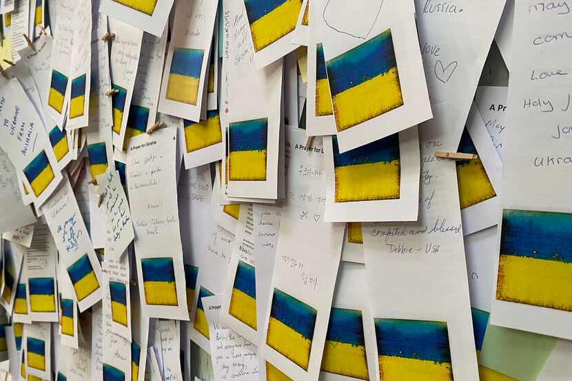 Handwritten prayers for Ukraine are clipped to a partition at the Bath Abbey in Bath,...