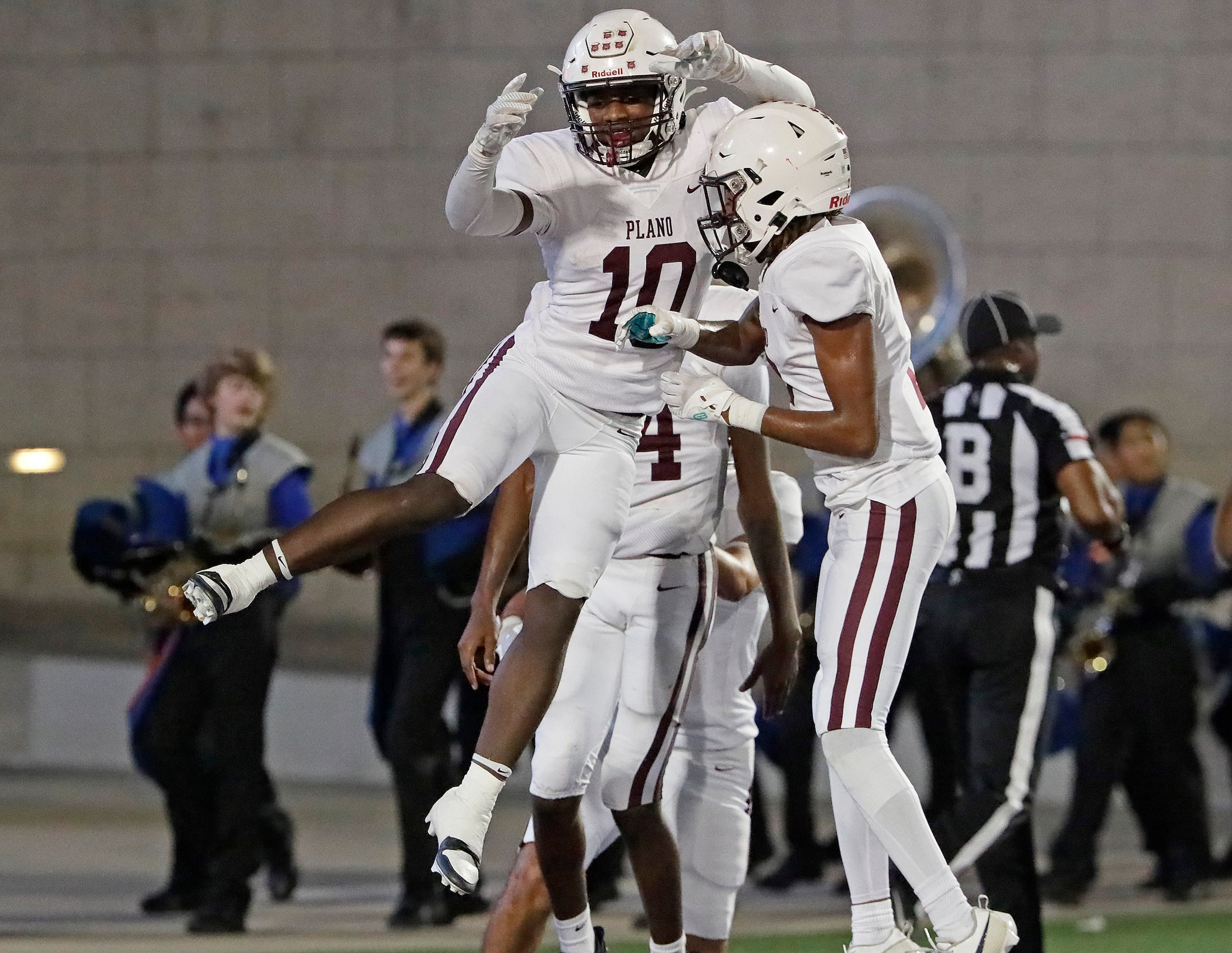 Plano High School wide receiver Donald Smith (10) celebrates scoring a touchdown during the...