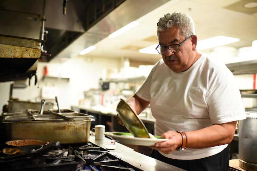Owner Fernando Luna prepares a lunch order at Luna’s Tortillas y Hacienda in Dallas. The...