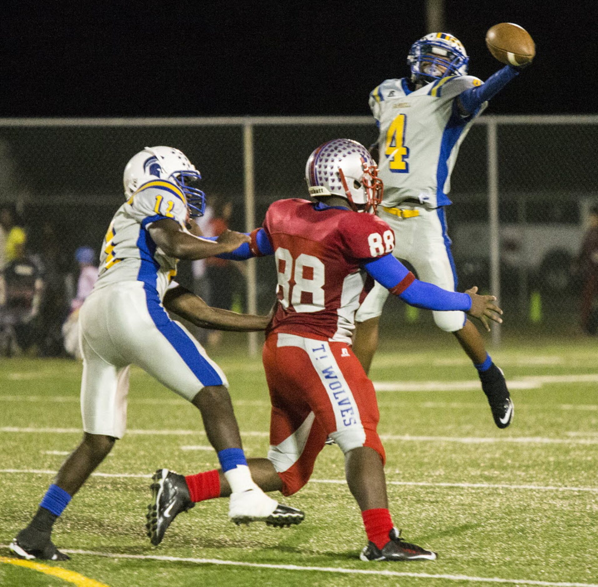 Samuell's Torrie McCoy (4) intercepts a pass during W. W. Samuell's matchup against Spruce...