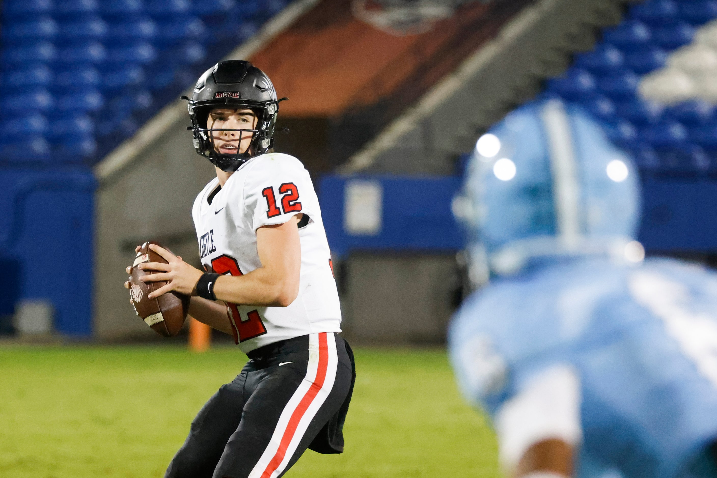 Argyle high school QB John Gailey (12) throws the ball against Emerson high school during...