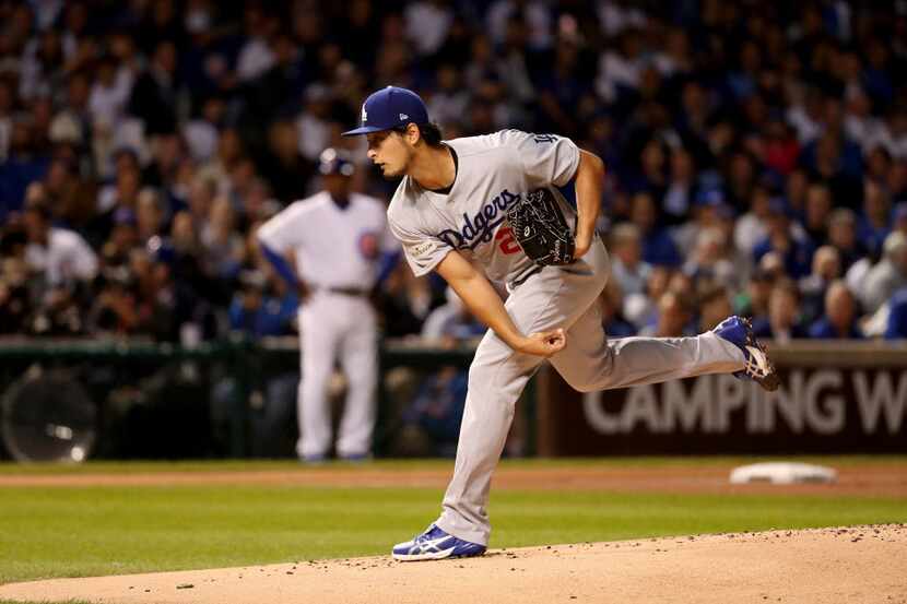 Los Angeles Dodgers starting pitcher Yu Darvish delivers against the Chicago Cubs in the...