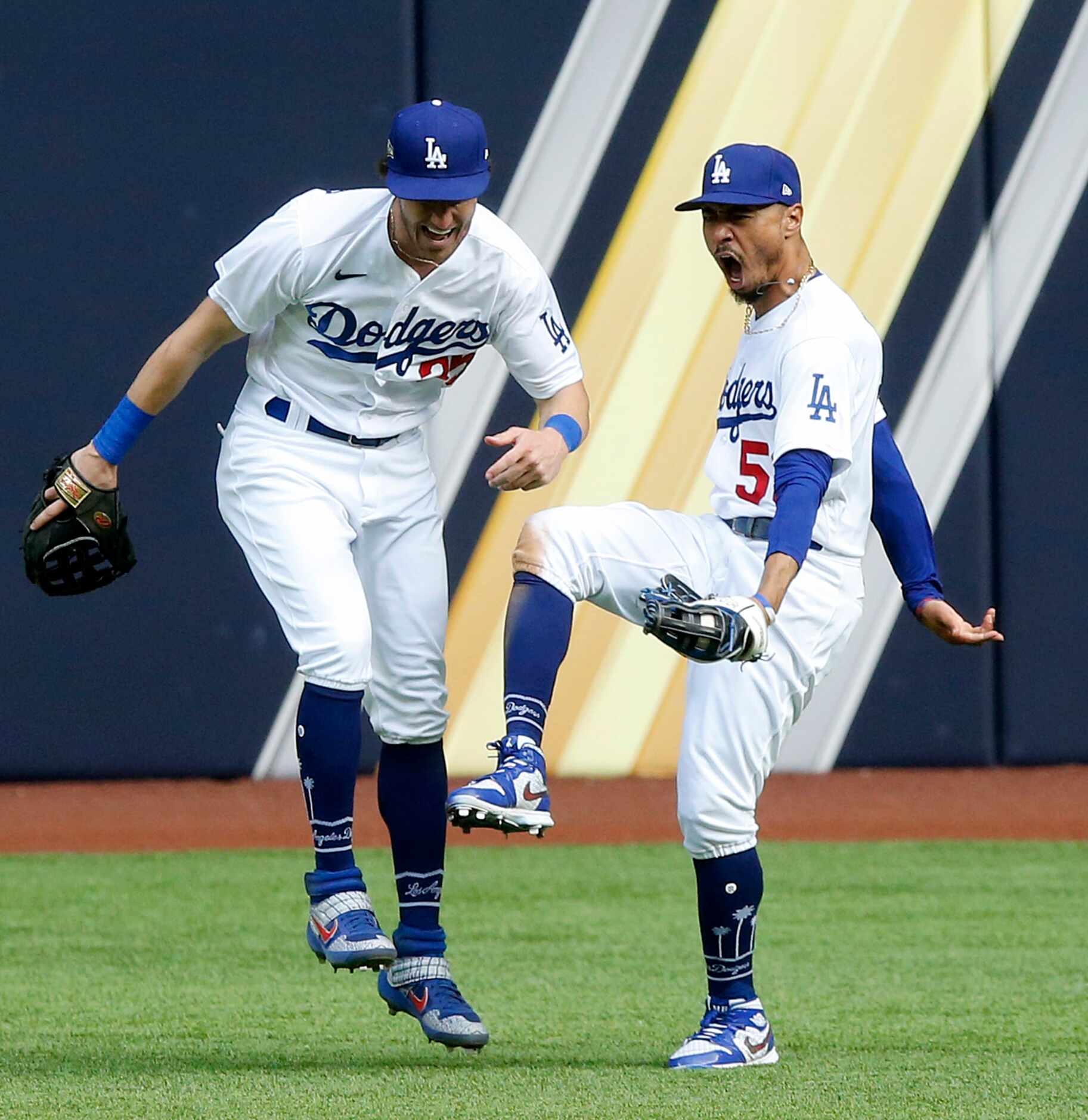 Los Angeles Dodgers right fielder Mookie Betts (50) celebrates with center fielder Cody...