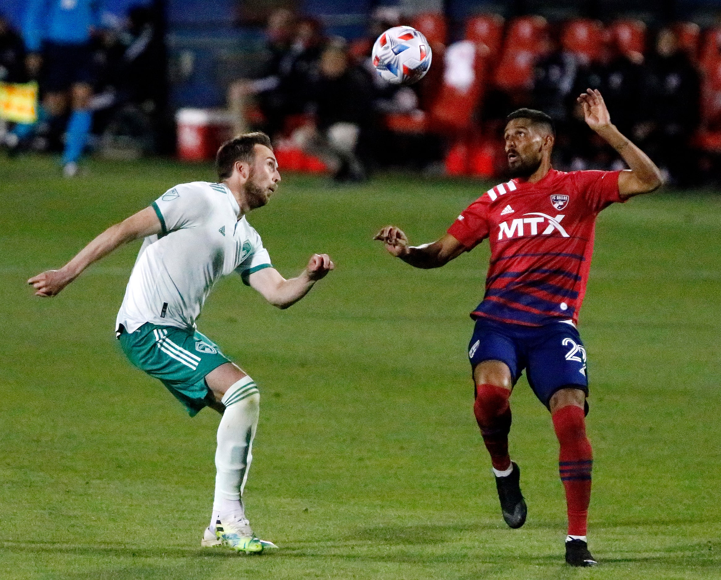 FC Dallas forward Franco Jara (29) and Colorado Rapids defender Danny Wilson (4) close in on...