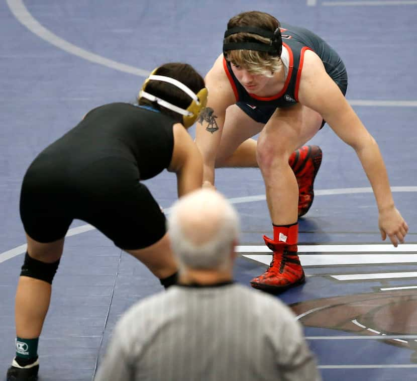 Euless Trinity transgender wrestler Mack Beggs (facing) eyes South Grand Prairie's Stephania...