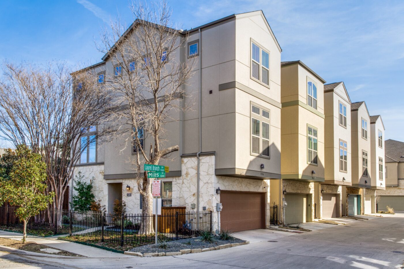 The three-story townhome is located on a corner lot.