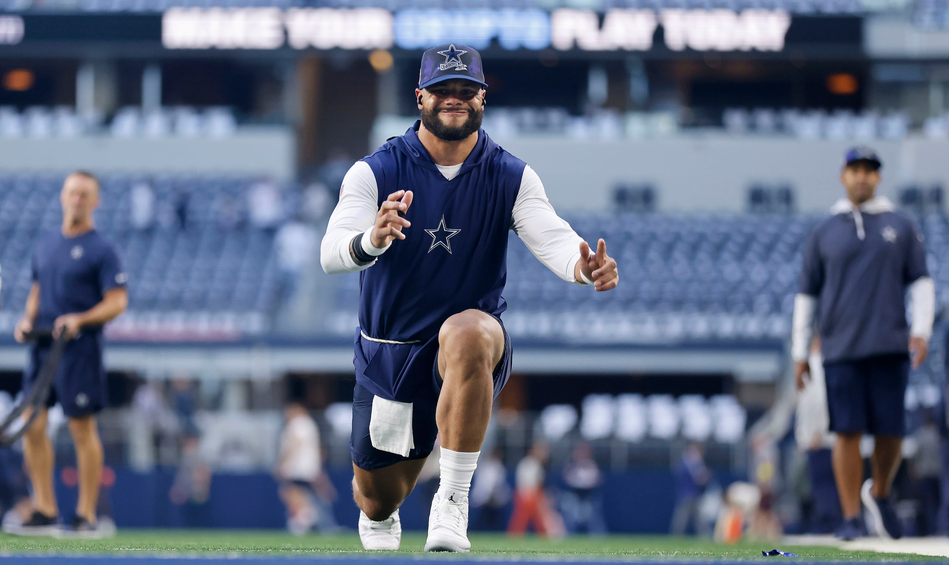 Dallas Cowboys quarterback Dak Prescott (4) stretches before their game against the Chicago...