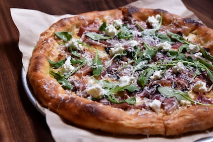 Prosciutto pizza with mission fig, goat cheese and arugula from North Italia in Dallas