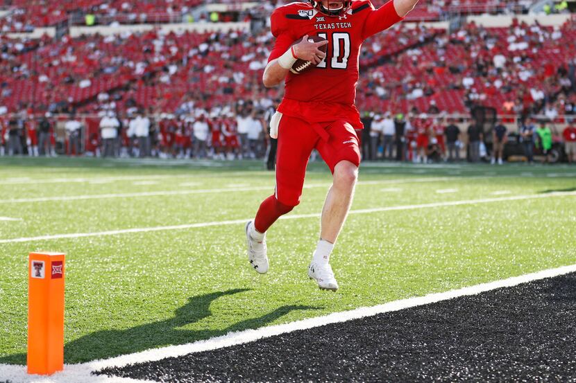 Texas Tech's Alan Bowman (10) scores a touchdown against Montana State during the second...