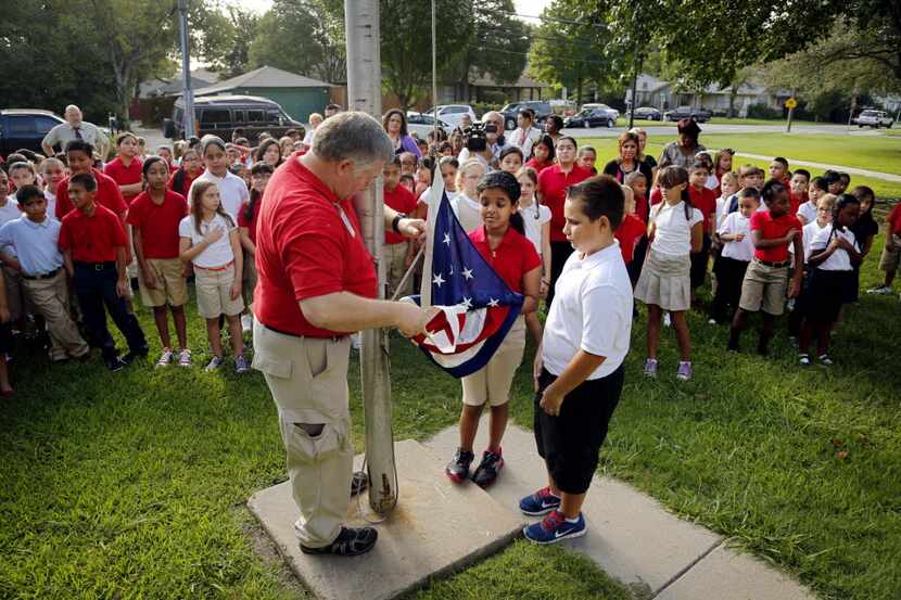 Brad Willingham (left), a physical education teacher at Robert E. Lee Elementary School,...