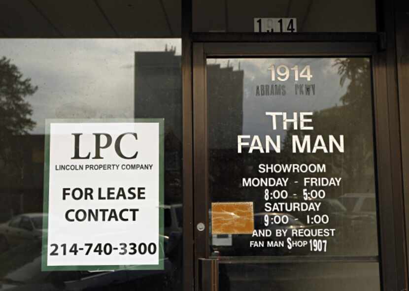 A "for lease" sign marks the storefront of a shuttered Lakewood business where the Fan Man...